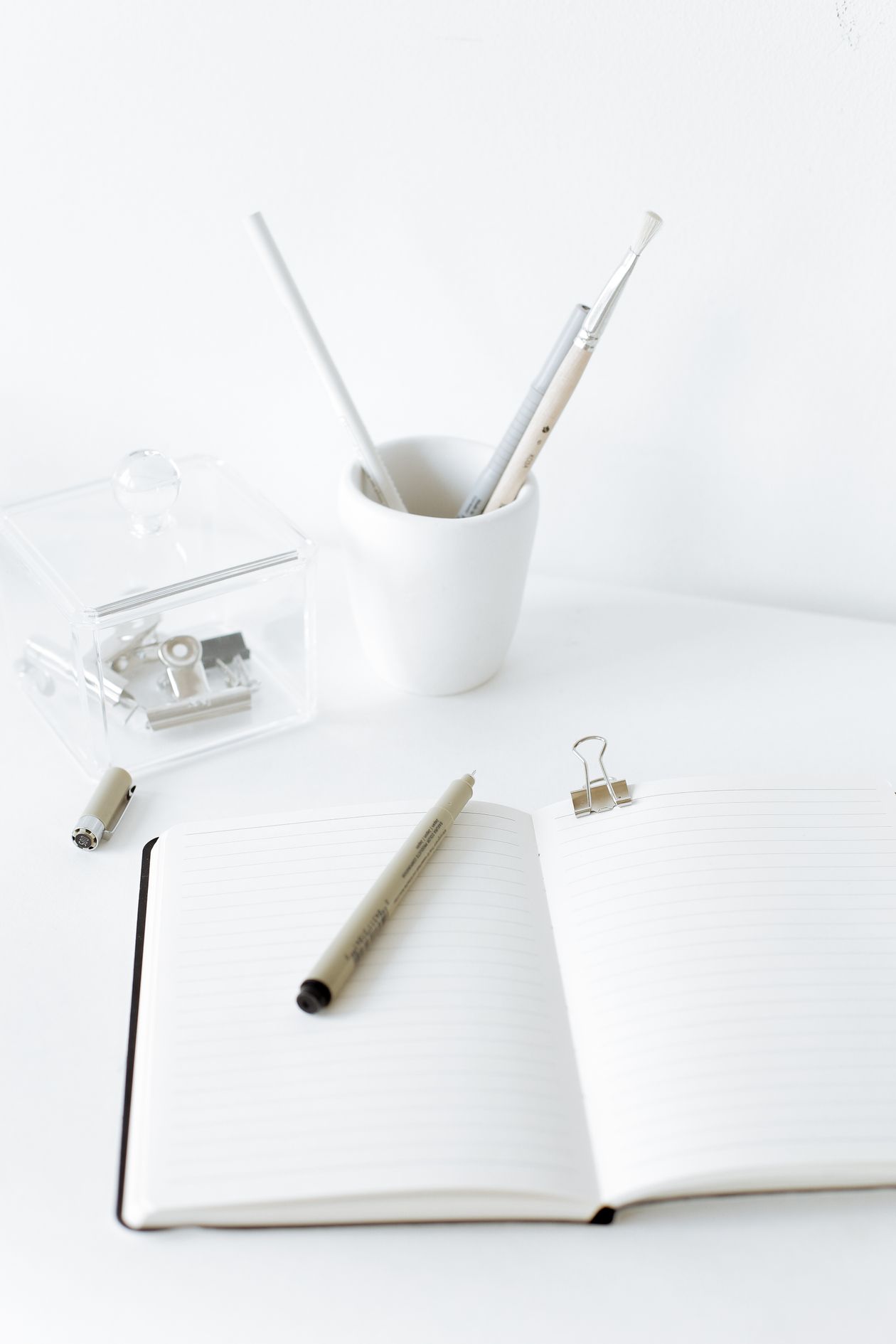 Dart Functions for Beginners: Parameters Made Simple Open notebook and pen on a desk for practicing Dart functions