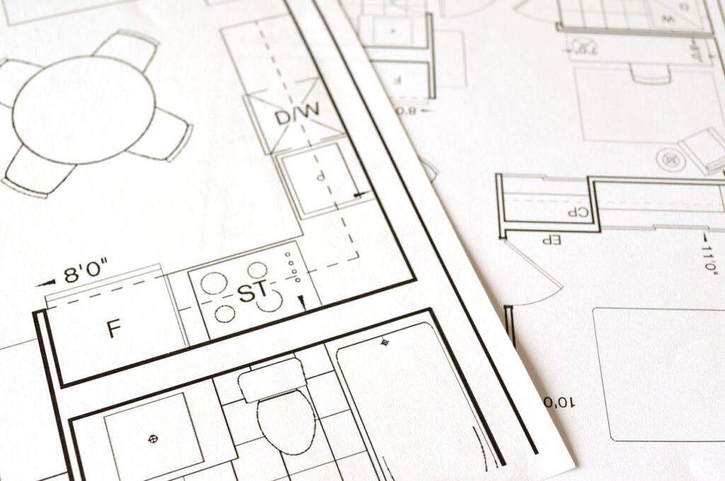 Dart Abstract Classes for Beginners: Blueprints Made Simple Architectural blueprint on a desk, a metaphor for a Dart abstract class