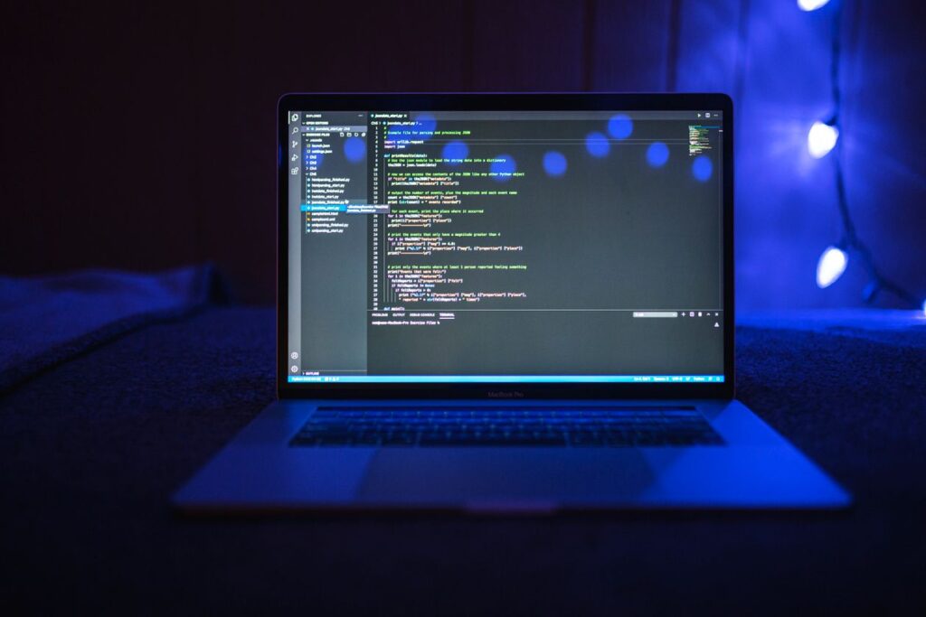 Dart mixins code shown on a laptop screen in a dark editor