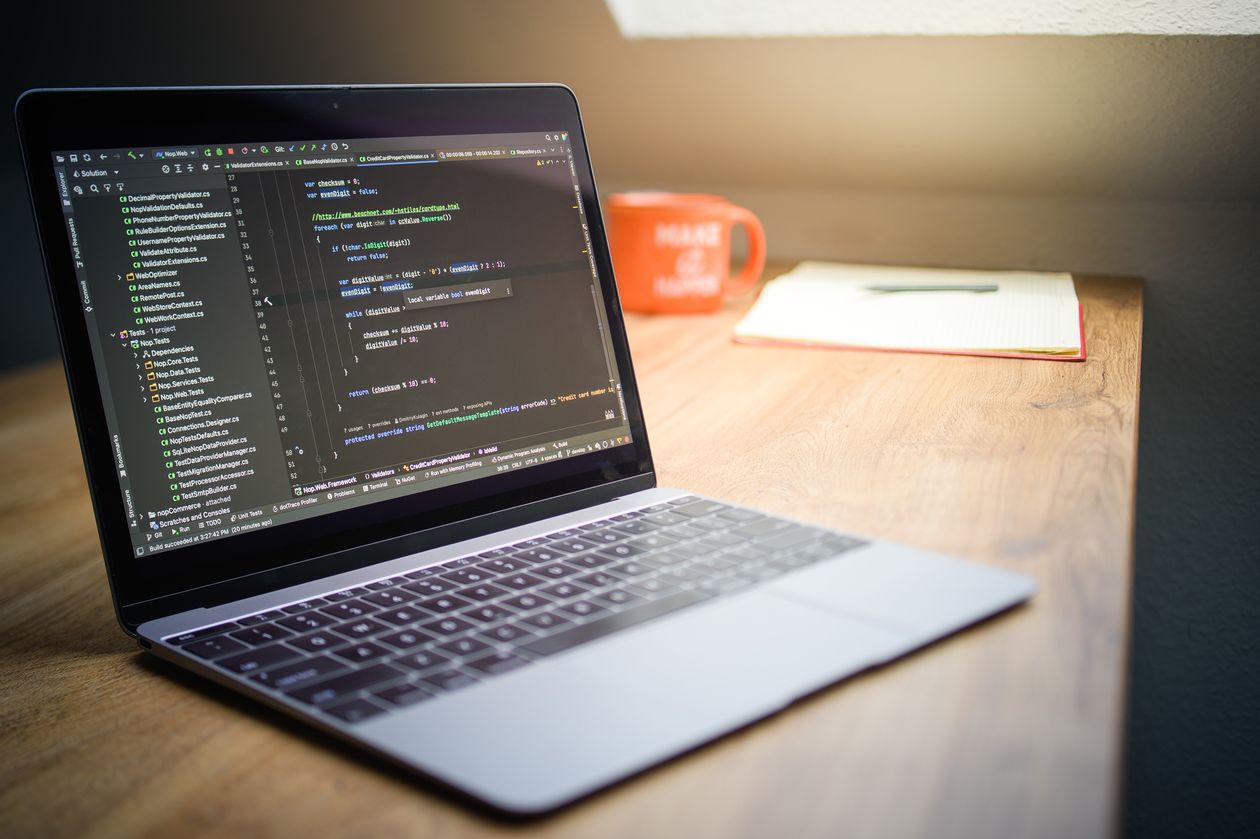 Developer desk with notebook and code notes for planning a class